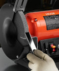 High Octane 8 Inch Variable Speed Bench Grinder delivering 550 Watt power, metal sharpening with 36 grit wheel in use.