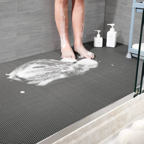 Game Changer Non Slip Drainage Flooring Rolls Custom Trim Down To Fit Pool Bathroom Garage Spa Warehouse Durable Water Resilient PVC Mats Thick Anti Fatigue Heavy Duty Commercial Grade Smooth Surface with feet on wet surface.