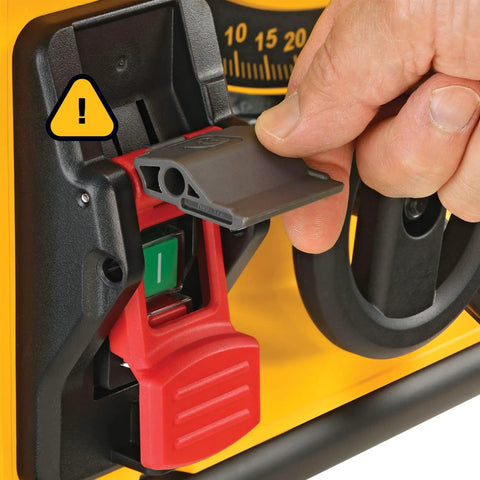 Close-up of Compact Portable Jobsite Table Saw with safety switch and adjustable setting dial on yellow casing.
