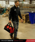 Man carrying Valve Lockout Tagout Kit For 55 LOTO Devices Including Ball, Butterfly, And Gate Valves, OSHA Compliant bag