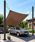 Car parked under shade sail supported by 2 Pack 10-Foot Shade Sail Poles, 2.6 Inch Diameter Steel Heavy Duty, Wind Resistant Shade Pole Kit.