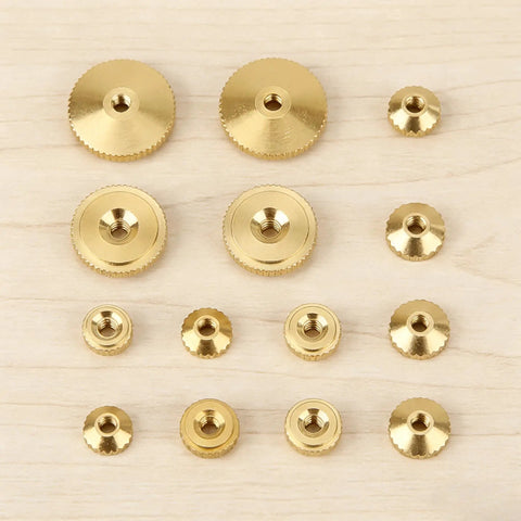 12 Piece Brass Clock Hand Nut Set For Replacement Hardware 5mm 6mm 10mm OD Threaded Fasteners on wooden surface