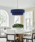 ELYCCUPA 20” Navy Blue Boho Hand Woven Pendant Light Brass Adjustable Coastal Chandelier above a dining table.