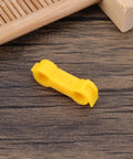 4mm Bird Splayed Leg Treatment Ring Set for Canaries Budgies Finches and Small Quail Hobble Leg Bands in yellow on wood surface