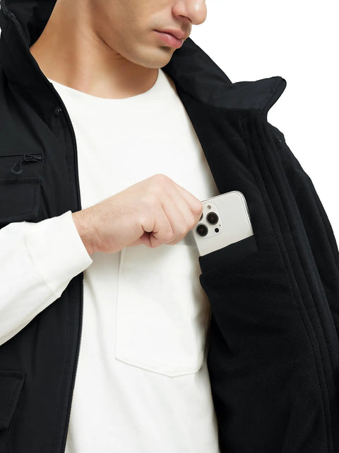 Close-up of man placing phone in pocket of Mens Fleece Lined Winter Vest Windproof Water Resistant Outerwear.