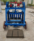Heavy Duty Concrete Block Making Machine Adjustable Brick Press For Commercial Workshop Use High Volume Output with stacked blocks.