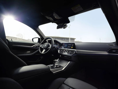 Interior view of BMW showcasing advanced dashboard technology and sleek design, illustrating premium quality features.