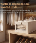 Straight Up Durable Cotton Linen Foldable Closet Organizer Bins Set Of Three With Tough Handles And Clear Window Collapsible Fabric Storage Cubes stacked with sweaters.