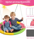 Two children sitting on a colorful 32 inch saucer swing from Heavy Duty Backyard Swing Set With Stand For Indoor Outdoor Fun.