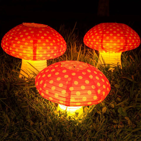 Six Pack Mushroom Paper Lanterns Set For Party Decor And Nursery Ornaments 3D Woodland Mushrooms on grass, glowing at night