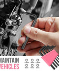 Hand using a hex key on a bicycle component, showcasing part of the Mini Compact Pink 24 Piece Household Tool Kit With Soft Grip Handles And Slick Carry Case Super Handy DIY Repair Set For Women Apartment Dorm Friendly Home Maintenance Must Have Pretty Dang Good Gear For Quick Weekend Fix Ups At Home.