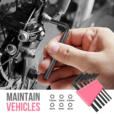 Hand using a hex key on a bicycle component, showcasing part of the Mini Compact Pink 24 Piece Household Tool Kit With Soft Grip Handles And Slick Carry Case Super Handy DIY Repair Set For Women Apartment Dorm Friendly Home Maintenance Must Have Pretty Dang Good Gear For Quick Weekend Fix Ups At Home.