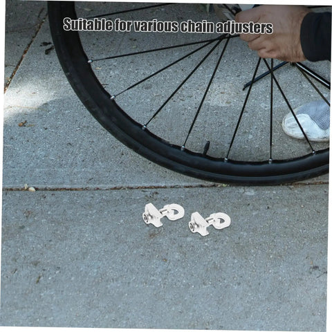 Adjustable Aluminum Alloy Bike Chain Tensioner Tool 2 Piece Set For Folding Bikes shown near bike wheel on pavement.