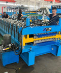 Industrial Grade Rock Solid Roof Sheet Forming Machine For Color Steel Panels And Galvanized Metal Roll Forming Equipment in workshop.
