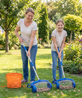 No Sweat Garden Roller Basket For Walnuts Pinecones And Gumballs Large Rolling Cage Sphere Sweeper used by two users gathering nuts in garden.