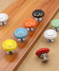 Totally Groovy Blue Mushroom Ceramic Cabinet Knobs, 6 Pack of Glossy Round Drawer Pulls for Dresser and Wardrobe, 1.38 Inch Diameter, Smooth Polish, 3 Screw Sizes Included, Home Makeover Essential on a wooden surface.
