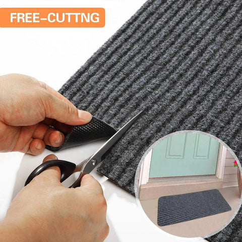 Hands cutting Cut To Fit Waterproof Door Mat Roll With Rubber Lining For Indoor Outdoor Use In Wet Weather
