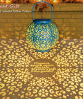 Teal Blue Solar Lantern Outdoor Garden Light 7.9 Inch Waterproof Metal Table Lamp casting intricate patterns.
