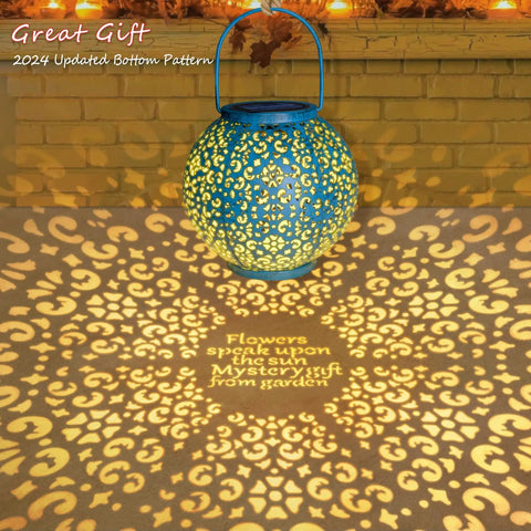 Teal Blue Solar Lantern Outdoor Garden Light 7.9 Inch Waterproof Metal Table Lamp casting intricate patterns.