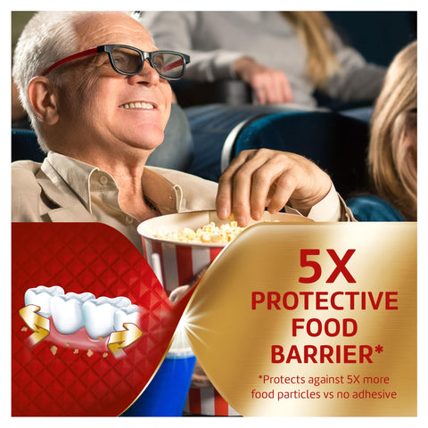 Man enjoying popcorn with Power Max Denture Adhesive Cream With Seal For Mega Hold And Food Seal Flavor Free 16x protection
