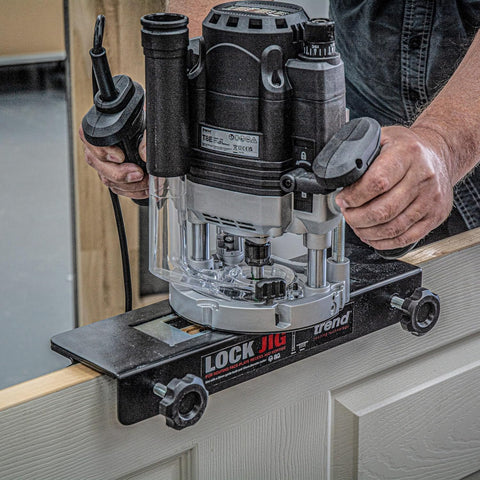 Beefy Dual-Mode Plunge Router 3-1/4 HP with 1/2 Inch Collet in use on a door edge, showing variable speed and precision centering system.