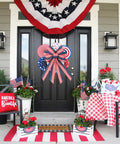 Front porch decorated with Two Pack Large Patriotic Wreath Bows 20x12 Inches Red White And Blue Star And Stripe Pattern Reusable