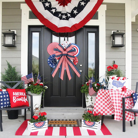 Front porch decorated with Two Pack Large Patriotic Wreath Bows 20x12 Inches Red White And Blue Star And Stripe Pattern Reusable