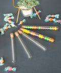 Glass Test Tube Set, 24 Pieces, 80ml Each, 25 By 200mm Glass Tubes With Cork Stoppers displayed with colorful beads.