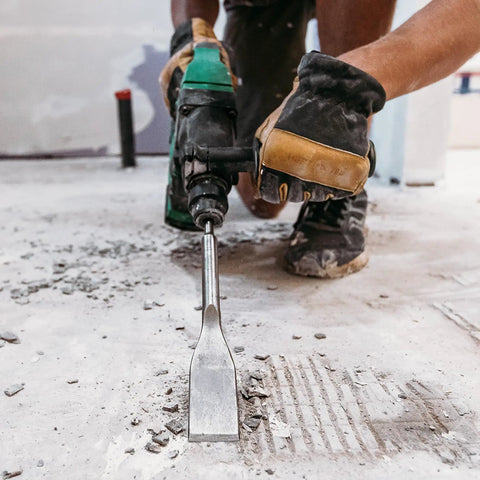 Close-up of 18V MultiVolt Rotary Hammer Tool Body Only No Battery Included With 1-1/32 Inch SDS Plus Chuck in use on concrete floor.