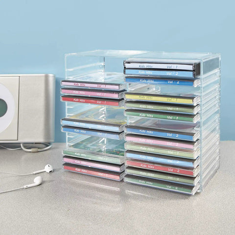 Stackable Clear Plastic CD Organizer With Rubber Feet For Home Theater Or Media Room, Holds Up To 30 Jewel Cases, BPA Free Durable American Made Design For Neat, Easy Access, Shelf Friendly Storage on a desk.