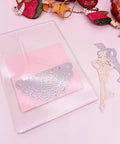 Must Have Four Transparent Acrylic Cutting Pads Set For 6.5 Inch Die Cutting Machines, 0.12 Inch Thick on pink surface with craft items
