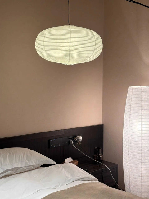 Large White Chinese Paper Ceiling Lamp Shade And Oval Pendant Light Cover With Vintage Round Chandelier Lantern Design For Easy Peasy Setup And Total Room Upgrades That Bring Killer Decor Vibes hanging above a bed.