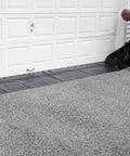 Reusable Water-Filled Flood Barrier Curb for Quick Home Flood Defense against a garage door, heavy-duty PVC, 6.5in by 10ft.