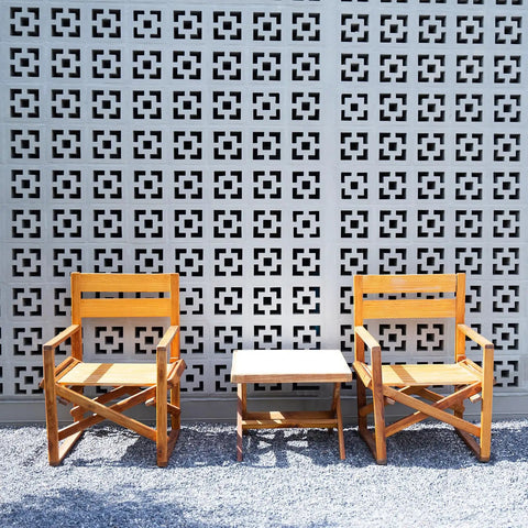 Two Pack Concrete Breeze Brick Molds with 11.81 Inch Double Square Pattern for DIY Casting used in wall decor behind wooden chairs