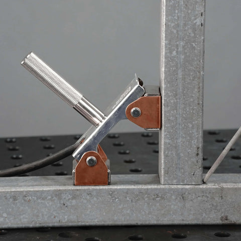 Side view of Hi-Temp Grounding Magnetic V-Pad with pure copper contact and nickel-plated handle installed on metal surface