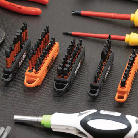 Ball End Hex Bit Set For Impact Drivers, 20 Pc Kit With Bit Holder And Carabiner, shown with various screwdrivers on table