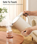 Pouring hot water from 1.7L Large Kettle With Temperature Control And LED Screen Quick Heat For Tea And Coffee 6 Presets.