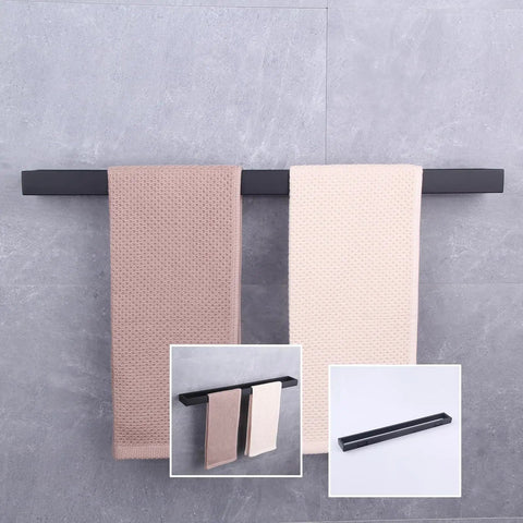 24-Inch Dope Matte Black Bathroom Towel Bar Stainless Steel Towel Rack Wall Mount for a Slick Modern Bath Upgrade 18/8 Rust Resistant Construction Easy Clean Durable Design, holding two towels against a gray wall.