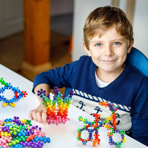 100 Piece Interlocking Building Blocks Set for Preschool Kids and Beginners STEM Toy That Is Kid Friendly and Super Durable Promoting Fine Motor Skills Sensory Development and Creative Thinking Through Hands On Construction Play, colorful blocks in use