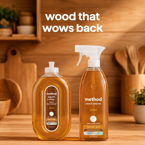 Daily Wood Cleaner Spray With Warm Almond Essence Knocks Out Stubborn Dust And Kitchen Grit While Skipping The Greasy Baggage Before It Sets In On Your Favorite Cabinetry And Hardwood - two bottles on a wooden countertop.