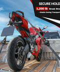 Red motorcycle secured with 2 pack self retracting ratchet tie downs 1 inch wide 10 feet long with auto rewind 1200 pound break strength