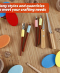 4 Piece Pottery Carving Tool Set With 5.9 Inch Wooden Handles Pro Grade Scrapers For Clay Sculpting on wooden table with sponges