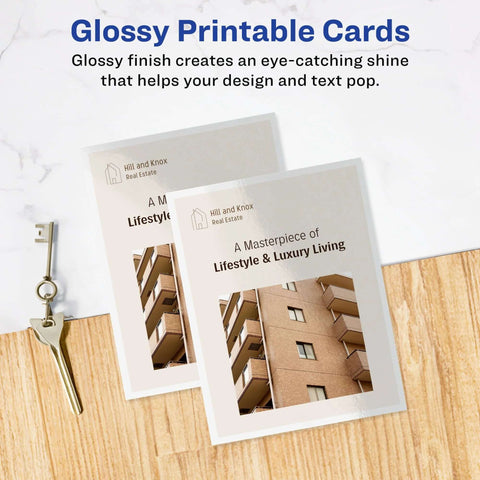 Avery printable postcards, glossy white, two real estate cards with Hill and Knox Real Estate logo on a desk