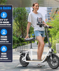 Woman standing next to Peak 800W Electric Scooter With Seat For Adults, white model on city path with size guide display.