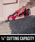Cutting carpet with PWR Core 12 12V Multi Cutter Kit With 2.0Ah Battery And Charger showing 1/4-inch cutting capacity