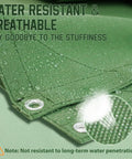 Close-up of Heavy Duty 5x7 Canvas Tarp In Green 12 Oz Durable Tarpaulin with Rustproof Grommets, showing water resistance
