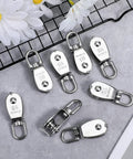 Heavy Duty 304 Stainless Steel Rope Pulley Set 16 Pack M15 Small Swivel Pulleys For Lifting And Towing Durable Wire Cable Wheel For Indoor Outdoor Clothesline And Rigging, 304 stainless steel M15 pulleys shown in a 16 pack