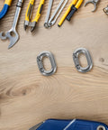 Front view of two stainless steel 8mm heavy-duty chain connectors with quick-connect design
