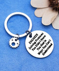 Engineer Solving Problems You Didnt Know You Had Keychain with gear charm on blue background.