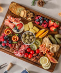 Top Shelf Solid Walnut End Grain Cutting Board Heavy Duty Kitchen Prep Surface with various foods, 17X13X1 inch, ideal for charcuterie.